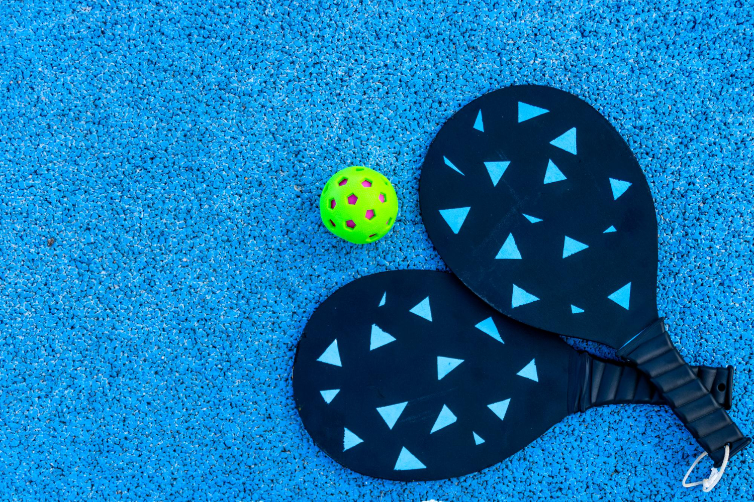 two darkblue pickleball