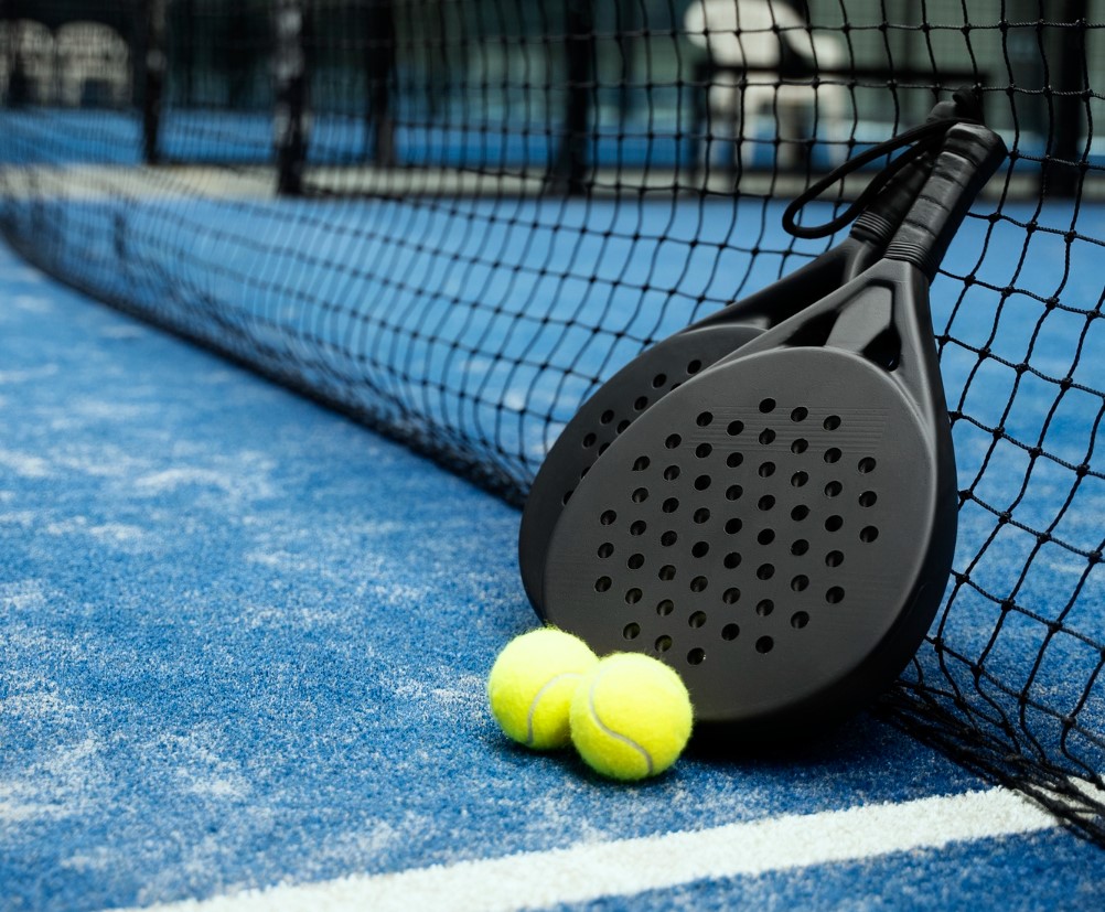 Black paddles and two tennis balls.