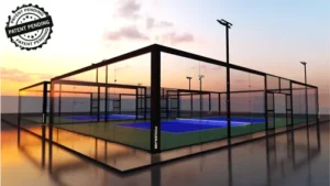 Pickleball court at dusk with glass pannel surrounds