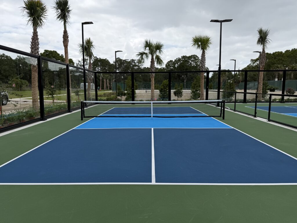 A 5-inch post-tensioned concrete slab for a pickleball court featuring integrated electrical conduit and drainage engineering.