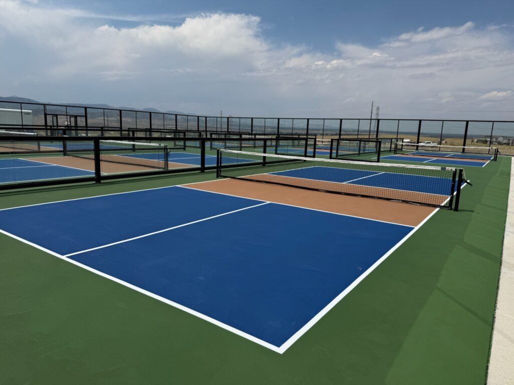 Application of professional-grade, high-performance sport surfacing on a newly engineered multifamily pickleball court.