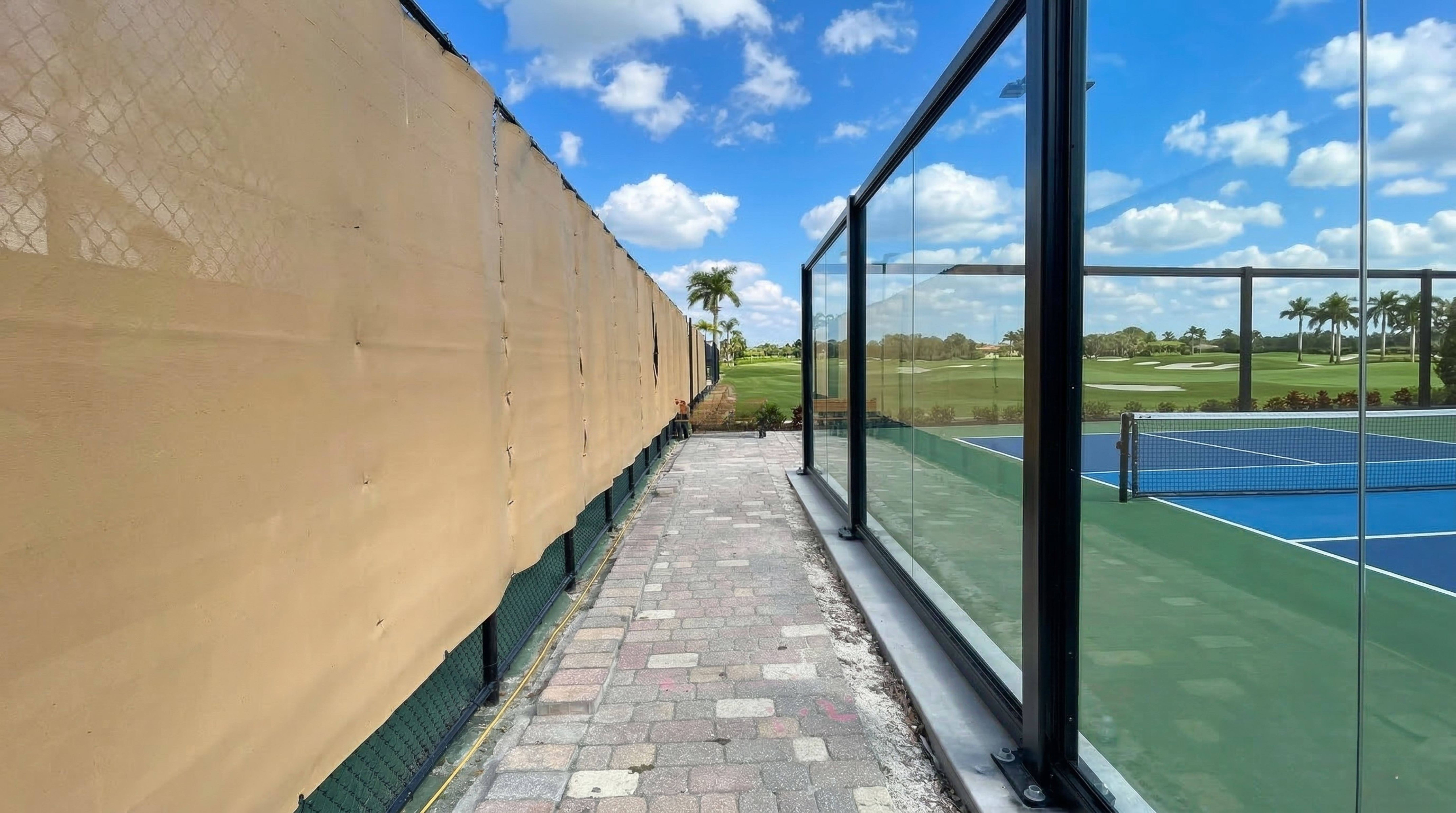 ASCE 7-16 wind-load-rated structural glass court enclosure built for high-wind environments and coastal region compliance.