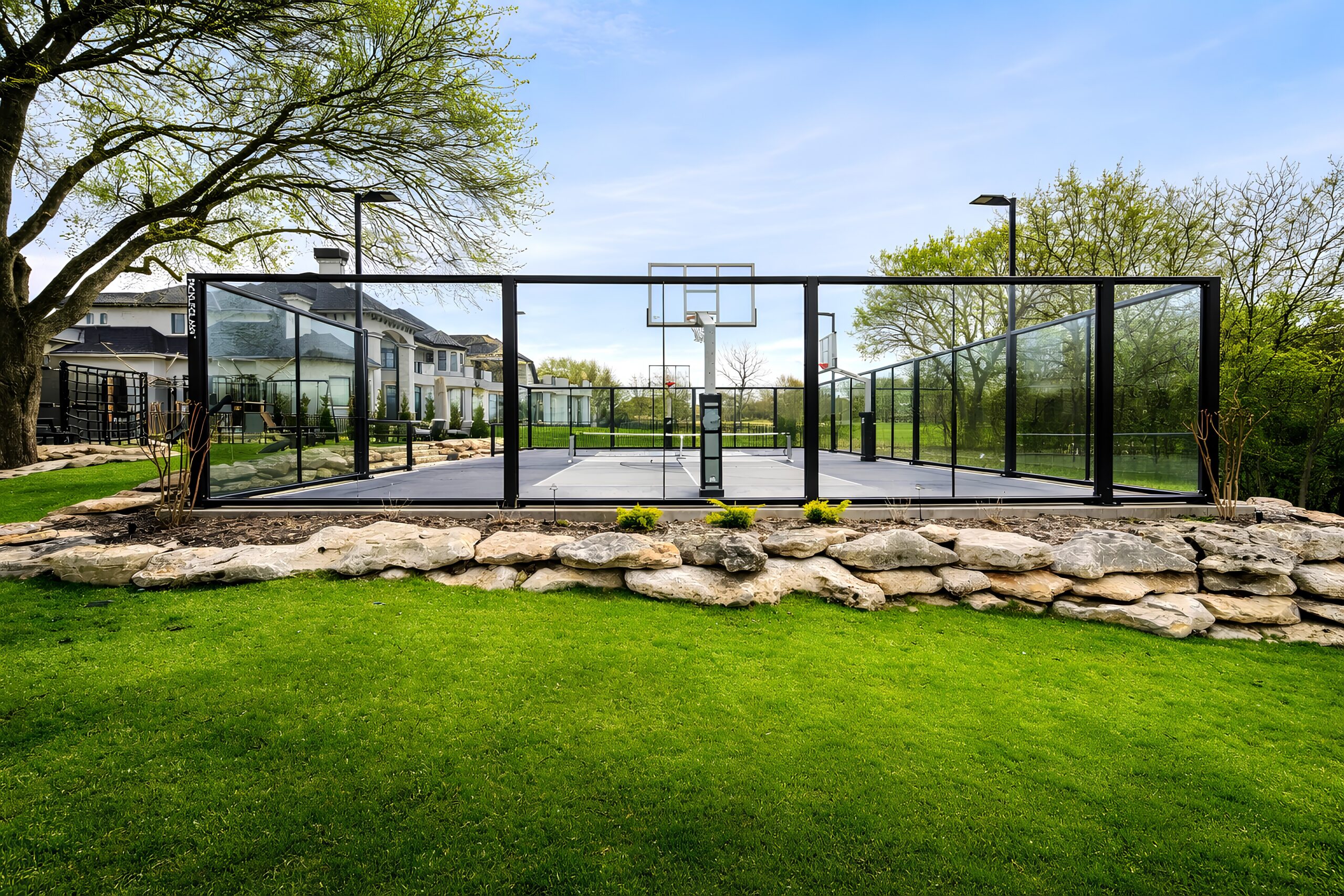 A complete premium court amenity showing surface, acoustic-rated enclosure, and integrated lighting scoped as one system