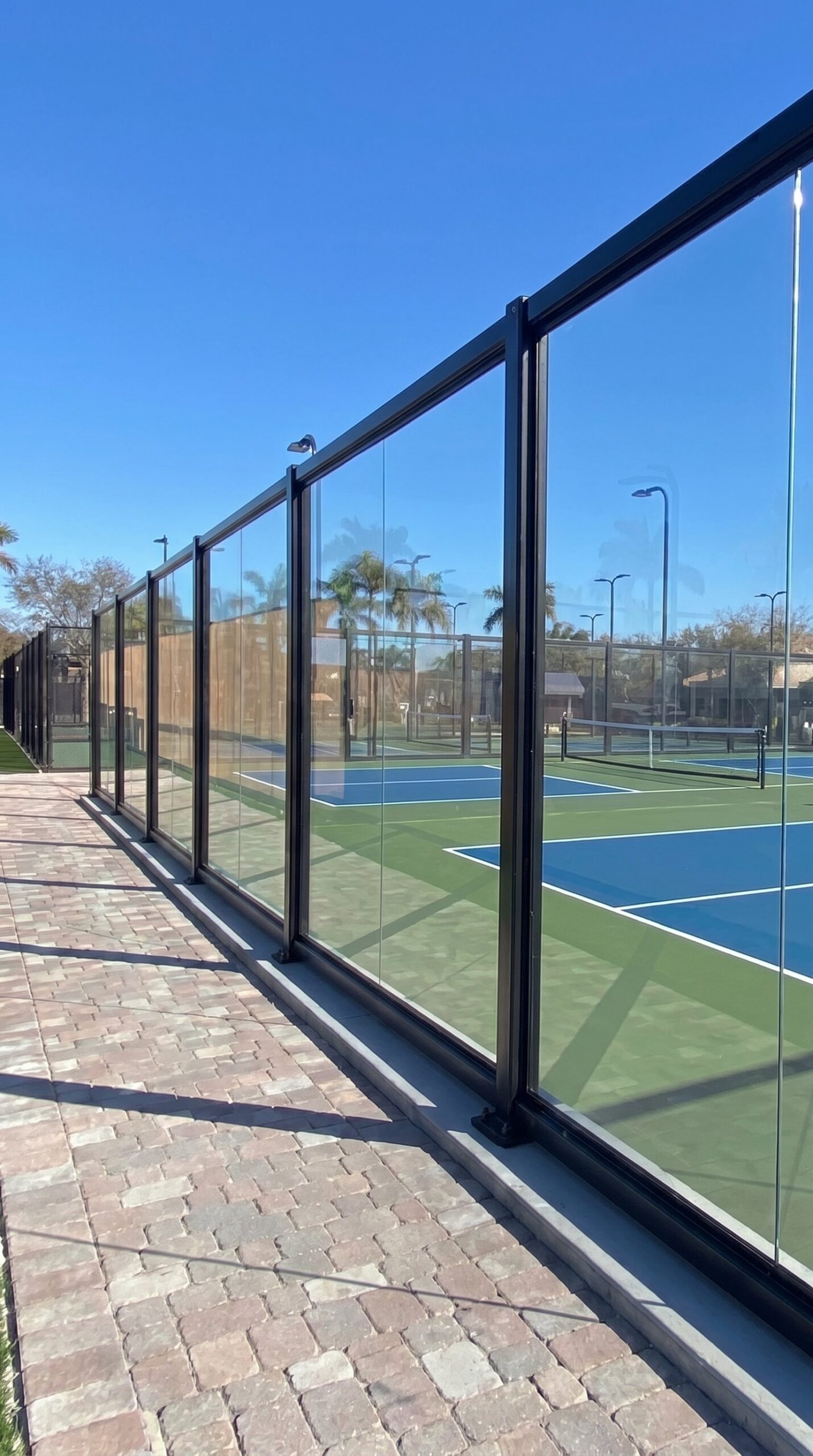 PICKLEGLASS court enclosure — Heritage Bay, Naples FL
